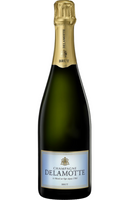 Champagne Delamotte Brut 12% 75cl is a refined and elegant Champagne from the Côte des Blancs, crafted predominantly from Chardonnay, with touches of Pinot Noir and Pinot Meunier. It boasts a bright golden hue and a lively mousse, offering aromas of citrus, white flowers, and toasted brioche. The palate is crisp and fresh, with flavors of lemon zest, green apple, and subtle minerality, leading to a harmonious and refreshing finish. Ideal as an aperitif, it also pairs wonderfully with seafood, sushi, or ligh