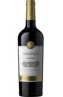 Tarapacá Reserva Carmenère is a smooth and aromatic Chilean red wine, showcasing ripe plum, blackberry, and black pepper aromas, complemented by notes of chocolate and subtle oak. The palate is medium-bodied with soft tannins and a velvety finish. Perfectly pairs with roasted meats, spicy dishes, or creamy cheeses.