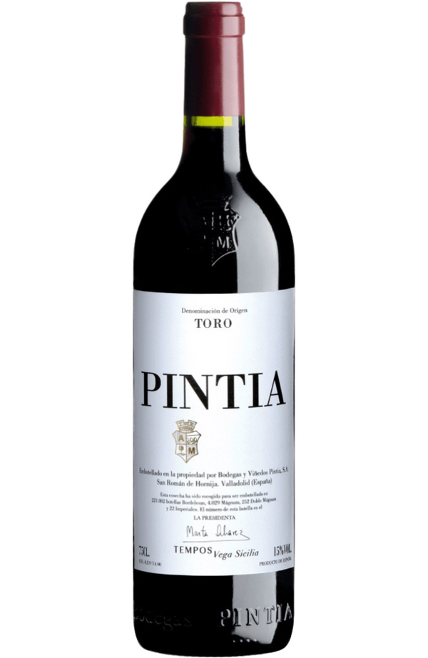 Vega Sicilia Pintia - Toro 14.5% 75cl from Spades Wines & Spirits. This bold Spanish red, crafted entirely from Tinta de Toro (Tempranillo), is a powerful expression of the Toro region. Bursting with aromas of black cherry, plum, and licorice, it is enhanced by subtle notes of cocoa, spice, and toasted oak from its careful barrel aging. The palate is robust yet refined, with firm tannins, vibrant acidity, and a lingering, complex finish. Perfect for pairing with roasted meats, hearty stews, or aged cheeses.