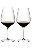 Two elegant red wine glasses filled with Cabernet Sauvignon, perfect for wine tasting and fine dining experiences.