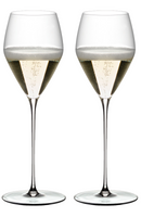 Two elegant champagne flutes filled with bubbly sparkling wine, perfect for celebrations and fine dining.
